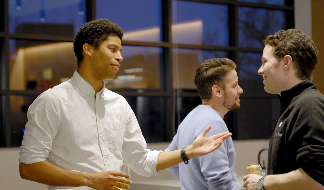 A founder in conversation with FRV members at a founder dinner